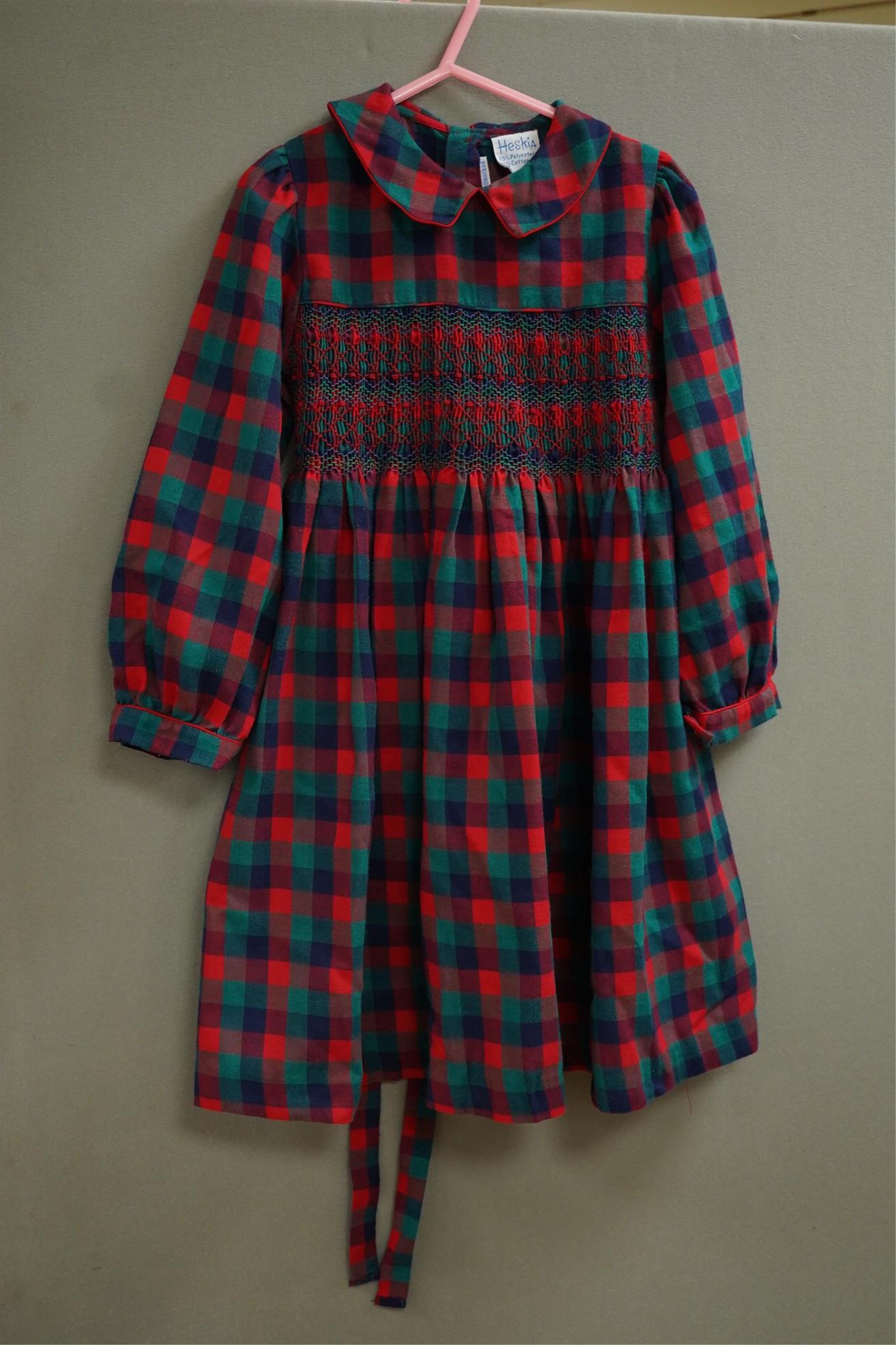 Twelve assorted 1980’s vintage children's dresses up to age eight, some hand smocked to include Harrods Belart, Chantel (including bell in hem), Michael de Leon, Heskia